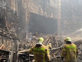 This video grab taken from a handout footage released by Russian Investigative Committee on March 23, 2024 shows rescuers working inside the Crocus City Hall. (HANDOUT/RUSSIAN INVESTIGATIVE COMMITTEE/AFP via Getty Images)