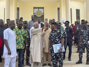 Kaduna state governor Uba Sani, centre, gestures after a meeting with security officers in Kaduna, Nigeria, Sunday, March 24, 2024.