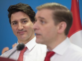 N.L. Premier Andrew Furey takes questions from reporters as Prime Minister Justin Trudeau looks on, in Clarenville N.L. on March 15, 2023.