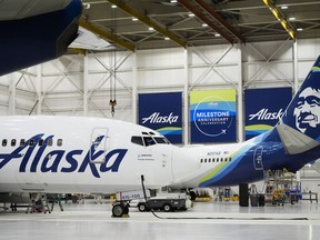 Alaska Airlines aircraft sit in the airline's hangar at Seattle-Tacoma International Airport