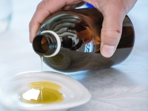 Taste-testing samples of olive oil