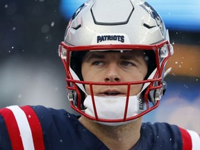 FILE - New England Patriots quarterback Mac Jones prior to an NFL football game against the New York Jets, Jan. 7, 2024, in Foxborough, Mass. A person familiar with negotiations says the Jacksonville Jaguars have agreed to acquire Mac Jones in exchange for a late-round pick in next month's NFL draft. The person spoke to The Associated Press on condition of anonymity Sunday, March 10, 2024 because the trade cannot become official until the new league year begins Wednesday and after Jones passes a physical.