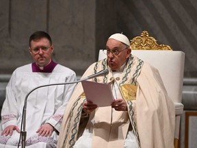 Pope Francis presides the Easter vigil as part of the Holy Week celebrations, at St Peter's Basilica in the Vatican on March 30, 2024.