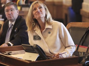 Kansas House Judiciary Committee Chair Susan Humphries, R-Wichita, watches an electronic tally vote as the House approves a bill requiring pornography websites to verify the ages of their Kansas visitors, Tuesday, March 26, 2024, at the Statehouse in Topeka, Kan. The measure is likely to be come law and have Kansas joining at least eight other states in requiring age verification.