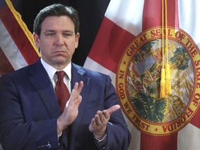 FILE 0 Florida Gov. Ron DeSantis applauds during a press conference at the Central Florida Tourism Oversight District headquarters at Walt Disney World, in Lake Buena Vista, Fla., Thursday, Feb. 22, 2024. Florida will have one of the country's most restrictive social media bans for minors -- if it withstands expected legal challenges -- under a bill signed by Republican Florida Gov. Ron DeSantis on Monday, March 25, 2024.