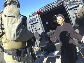 This image taken from Denver Police body camera footage provided by the American Civil Liberties Union of Colorado shows Ruby Johnson, a 78-year-old Colorado woman, surrounded by SWAT officers, Jan. 4, 2022, in Colorado.