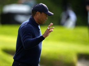 Tiger Woods acknowledges the gallery after finishing on the sixth green during the second round of the Genesis Invitational golf tournament at Riviera Country Club Friday, Feb. 16, 2024, in the Pacific Palisades area of Los Angeles.