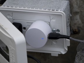 A device is plugged into an electrical outlet