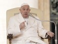 Pope Francis delivers his speech during his weekly general audience in the St. Peter's Square at the Vatican, Wednesday, March 13, 2024. Pope Francis says he has no plans to resign and isn't suffering from any health problems that would require doing so, saying in a new memoir he still has "many projects to bring to fruition." Francis, 87, made the comments in an autobiography, "Life: My Story Through History," which is being published Tuesday, March 19, 2024, the 11th anniversary of his installation as pope.