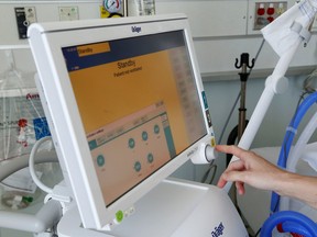 A Quinte Health Care worker demonstrates the use of a ventilator