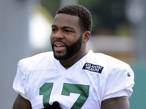 FILE - New York Jets wide receiver Braylon Edwards heads to the practice field at their NFL football training camp Saturday, July 27, 2013, in Cortland, N.Y. A man has been charged with attempted murder in a locker room attack at a suburban Detroit YMCA that was broken up by former NFL player Braylon Edwards. Edwards said he was "just minding my business" Friday, March 1, 2024, when he heard a dispute about loud music at the recreation center in Farmington Hills. Edwards said he stopped the assault of an 80-year-old man, who had a head injury.