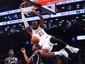 LeBron James of the Los Angeles Lakers dunks the ball against the Brooklyn Nets.