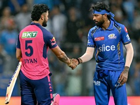 Mumbai Indians' captain Hardik Pandya (right) greets Rajasthan Royals' Riyan Parag after their IPL match.