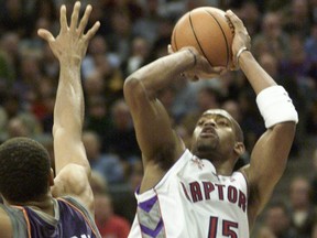 Toronto Raptors' Vince Carter scores over Phoenix Suns' Shawn Marion.