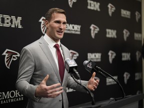 Atlanta Falcons QB Kirk Cousins speaks at a news conference.