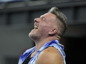 Pat McAfee laughs while attending a NFL game earlier this year.