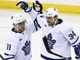 Toronto Maple Leafs' Auston Matthews (34) celebrates his goal with Max Domi (11).