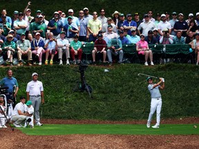 Rickie Fowler plays his shot from the ninth tee during the Par Three Contest prior to the 2024 Masters Tournament.