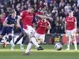 Wrexham's Paul Mullin scores their side's second goal from the penalty spot during the English League Two soccer match between Wrexham and Mansfield Town.