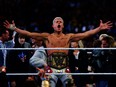 Cody Rhodes celebrates after defeating Roman Reigns for the undisputed Universal Championship.