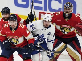 Florida Panthers goaltender Anthony Stolarz (41) looks on as Toronto Maple Leafs' Auston Matthews battles in front of the net.