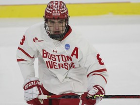 Boston U defenceman Cade Webber plays during an NCAA hockey game.