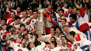 The Montreal Canadiens pose for a photograph with the Stanley Cup in 1993.