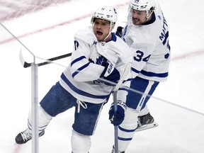 Toronto Maple Leafs' Max Domi celebrates after his goal against Boston Bruins with Auston Matthews.