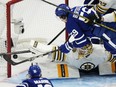 Boston Bruins goaltender Jeremy Swayman (1) makes a save on Toronto Maple Leafs' Tyler Bertuzzi.