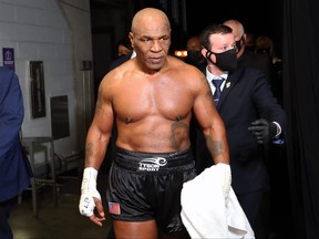 Mike Tyson exits the ring after receiving a split draw against Roy Jones Jr. in 2020.