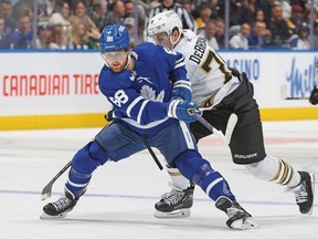 William Nylander #88 of the Toronto Maple Leafs breaks past Jake DeBrusk #74 of the Boston Bruins during the first period in an NHL game at Scotiabank Arena on March 4, 2024 in Toronto.