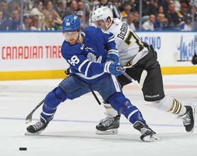 William Nylander #88 of the Toronto Maple Leafs breaks past Jake DeBrusk #74 of the Boston Bruins during the first period in an NHL game at Scotiabank Arena on March 4, 2024 in Toronto.