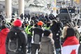 So-called Freedom Convoy protesters are shown in Ottawa on Feb. 18, 2022. (Jean Levac/Postmedia Network)