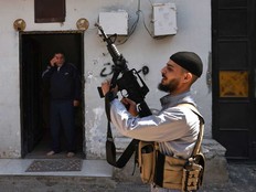 A Palestinian gunman attends the funeral of Mohammad Shahmawi after was killed during a raid by Israeli forces on April 12, 2024, al-Faraa camp in the occupied West Bank, amid ongoing battles between Israel and the Palestinian militant group Hamas in Gaza.