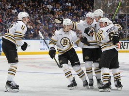 Brad Marchand #63 of the Boston Bruins celebrates his goal with Trent Frederic #11, Danton Heinen #43 and Charlie McAvoy #73 against of the Toronto Maple Leafs in Game Three of the First Round of the 2024 Stanley Cup Playoffs at Scotiabank Arena on April 24, 2024 in Toronto. Claus Andersen/Getty Images