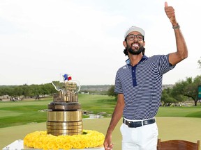 Akshay Bhatia of the United States poses with the trophy after winning the Valero Texas Open on the 18th hole of the first playoff during the final round of the Valero Texas Open at TPC San Antonio on April 7, 2024 in San Antonio, Texas.