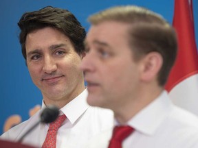 N.L. Premier Andrew Furey takes questions from reporters as Prime Minister Justin Trudeau looks on, in Clarenville N.L. on March 15, 2023.