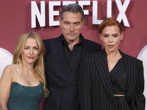 Gillian Anderson, from left, Rufus Sewell and Billie Piper pose for photographers upon arrival at the world premiere of the film "Scoop" on Wednesday, March 27, 2024 in London.