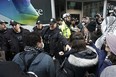 Police clash with protesters outside a fundraising event for Prime Minister Justin Trudeau, in Toronto, Friday, March 15, 2024.