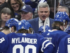 Maple Leafs head coach Sheldon Keefe speaks to his players late in the third period against the Florida Panthers in Toronto on Monday, April 1, 2024.