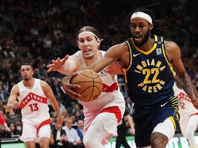 Indiana Pacers forward Isaiah Jackson and Toronto Raptors forward Kelly Olynyk battle for the ball during first half NBA basketball action in Toronto on Tuesday night. Nathan Dennette/THE CANADIAN PRESS