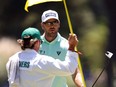 Corey Conners of Canada reacts after making birdie on the third green during the third round of the 2024 Masters Tournament at Augusta National Golf Club on April 13, 2024 in Augusta, Ga.