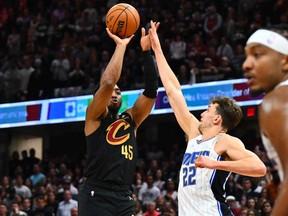 Donovan Mitchell of the Cleveland Cavaliers shoots over Franz Wagner of the Orlando Magic during the fourth quarter of game five of the Eastern Conference First Round Playoffs at Rocket Mortgage Fieldhouse on April 30, 2024 in Cleveland, Ohio.
