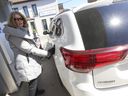 Customers at the Pioneer station on Gerrard St. East and Main St. near the Toronto Beach area like Dawn Barbieri (pictured) weren't happy with having to pay an 3.3 cents per litre more in carbon tax but said what can you do it is a necessary evil when you have to fill up your vehicle. on Monday April 1, 2024. Jack Boland/Toronto Sun/Postmedia Network