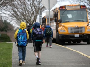 Students leave the Thurgood Marshal Elementary school after the Seattle Public School system was abruptly closed due to coronavirus fears on March 11, 2020 in Seattle, Washington.