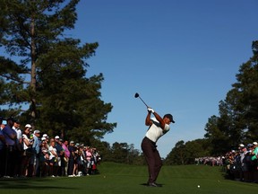 Tiger Woods of the United States hits his shot from the 15th tee during a practice round prior to the 2024 Masters Tournament at Augusta National Golf Club on April 08, 2024 in Augusta, Georgia.