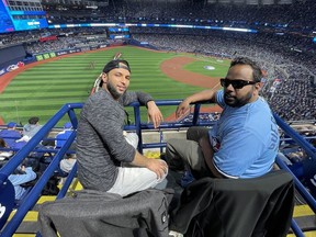 Michel Mandool and Joseph Mandool check out the view at the newly renovated Rogers Centre on Monday, April 8, 2024, in Toronto.