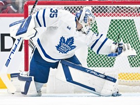 Maple Leafs goalie Ilya Samsonov reaches for the puck as it passes wide of his net during first period NHL action against the Canadiens at the Bell Centre in Montreal, Saturday, April 6, 2024.
