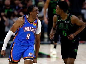 Jalen Williams, left, of the Oklahoma City Thunder reacts after scoring a three-point basket during the fourth quarter in Game 4 of the first round of the 2024 NBA Playoffs against the New Orleans Pelicans at Smoothie King Center on April 27, 2024 in New Orleans, La.