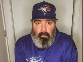 Blue Jays fan and wheelchair user Oliver Zlatanovksi, 41, of Oshawa (pictured here at home) was disappointed after he said he was removed from what he thought was an accessible seating area at Rogers Centre's field level and told to go up to the concourse level.